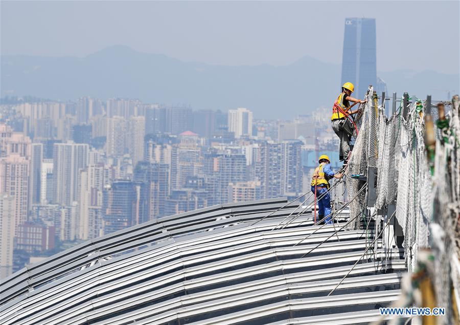 People work in heatwave in China's Chongqing